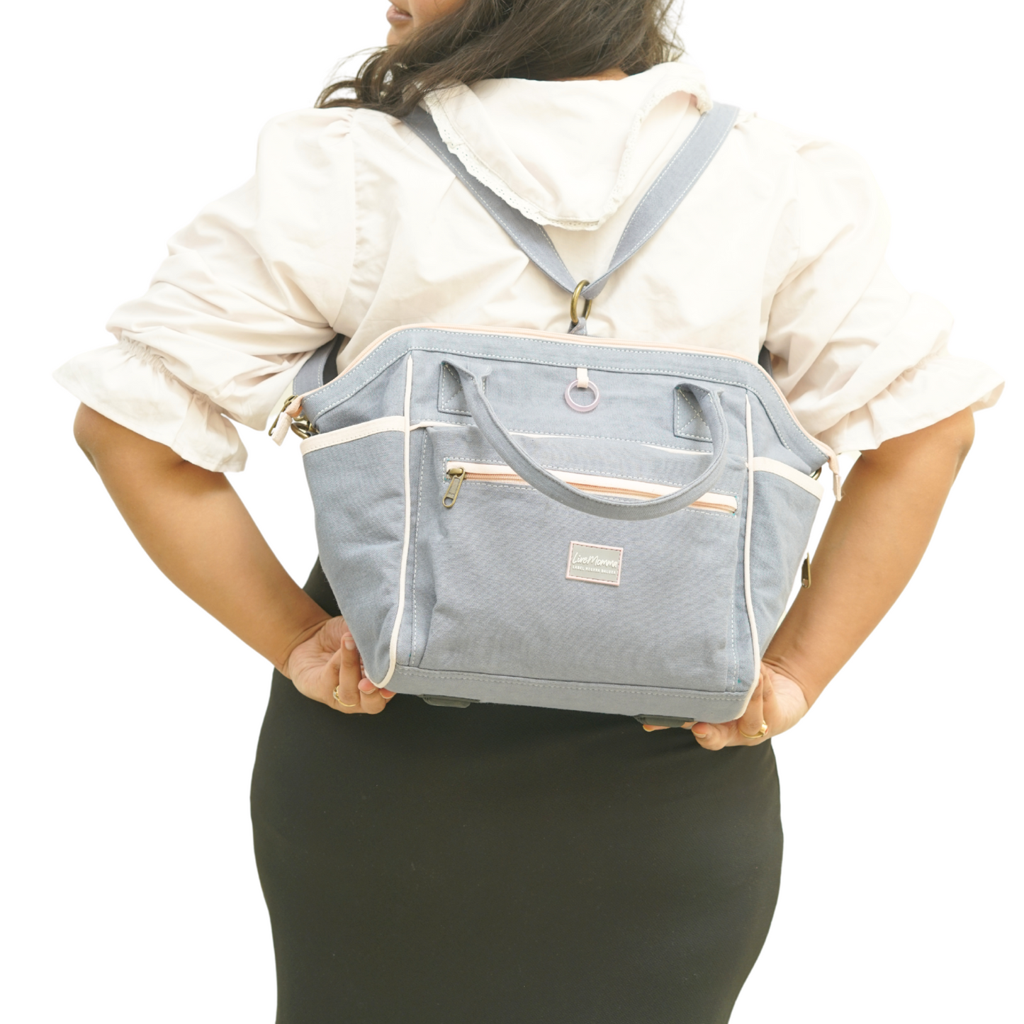 Rose quartz healing hand bag in steel blue and misty rose pink, versatile for mothers, with backpack, handbag, and baby bag features.